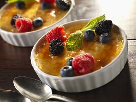 Creme Brulee in with fresh berries