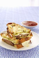 Roast Beef, Cheese and Pesto Panini; Halved and Stacked; Dipping Sauce