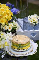 A decorated cake and spring flowers