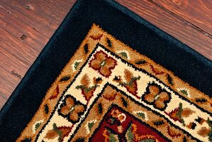 Corner of an Area Rug on an Old Pine Floor