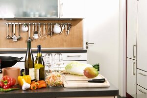 Various ingredients on work surface in a kitchen