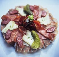 Platter of sausage products and cheese