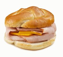 Ham and Cheese Sandwich on Pretzel Roll; White Background