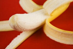 A half-peeled banana