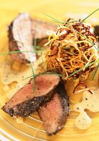 Beef fillet with a deep fried nest of vegetables