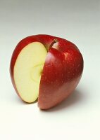 A red apple with a section cut out