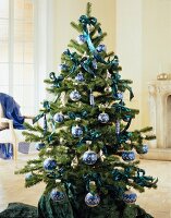 Christmas tree with dark blue decoration, baubles and river