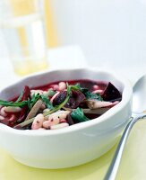 Close-up of bean pot with beetroot in bowl