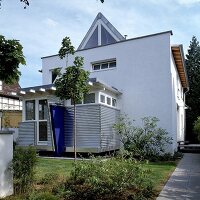 Anbau eines Einfamilienhauses aus den 50er Jahren mit Satteldach
