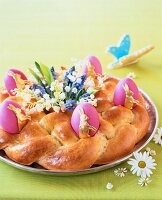 A bread wreath decorated for Easter
