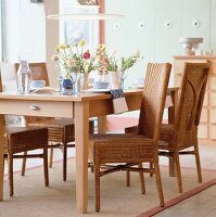 Rattan chairs with table and two flower vase