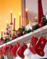 Stocking hanging on mantelpiece with lit candles