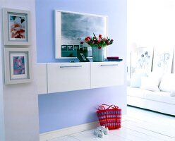 White cabinets on lilac wall