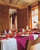 Festively decorated table with candles for Christmas