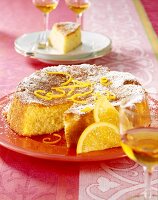 Almond cake with slices of orange on plate