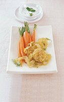 Fenchel-Möhren mit Couscous-Bällchen auf weißer Platte