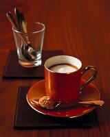 Macchiato espresso in cup on saucer with spoon