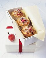 Apple spice muffins with parchment in box