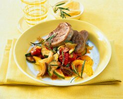 Pork with ratatouille and rosemary in serving dish