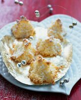 Coconut macaroons decorated with wires and beads on heart shaped plate