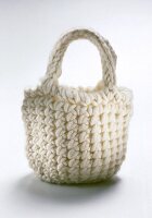 White knitted bag on white background