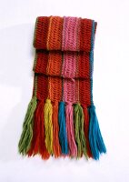 Colourful woolen scarf on white background