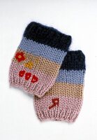 Knitted wrist cuffs on white background