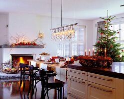 Kitchen and dining area decorated with candles and Christmas tree for Christmas