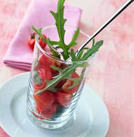 Marinated tomato with arugula in glass
