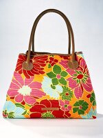 Close-up of colourful handbag with floral pattern
