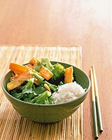 Asian vegetables with rice in bowl