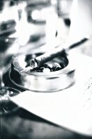 Close-up of cigar on ashtray, black and white