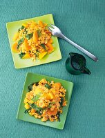 Lentil and pumpkin curry on two green plates, beneficial to prevent cancer