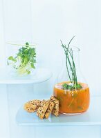 Vegetable and herb drink made of carrot and sauerkraut with crackers