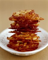 Honey florentines with fine almonds and pine nuts on plate