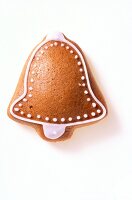 Close-up of gingerbread bell on white background