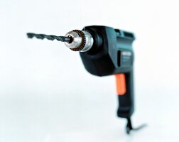 Close-up of drill machine on white background