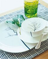 Close-up of green and white crockery on table