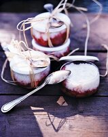 Rice pudding with strawberries in jars for a picnic