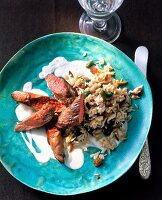 Lamb fillet with spiced rice on plate