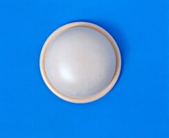 Diaphragm on blue background, overhead view