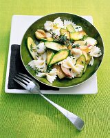 Farfalle with zucchini and mozzarella in plate