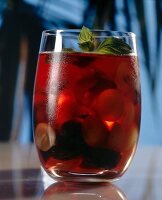 Punch with exotic fruits in glass