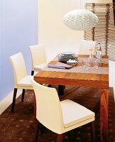 Dining room with brown dining table and white lamp