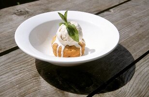 Spotted dick served with ice-cream on plate