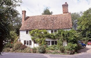 English house with red roof and chimney