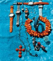 Various jewellery and watches from coral and turquoise