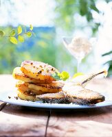 Dessert of grilled pineapple and banana with orange caramel