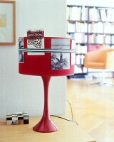 Close-up of photographs on red retro lampshade