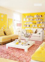 Living room with yellow painted walls, sofa, armchairs and fur carpet